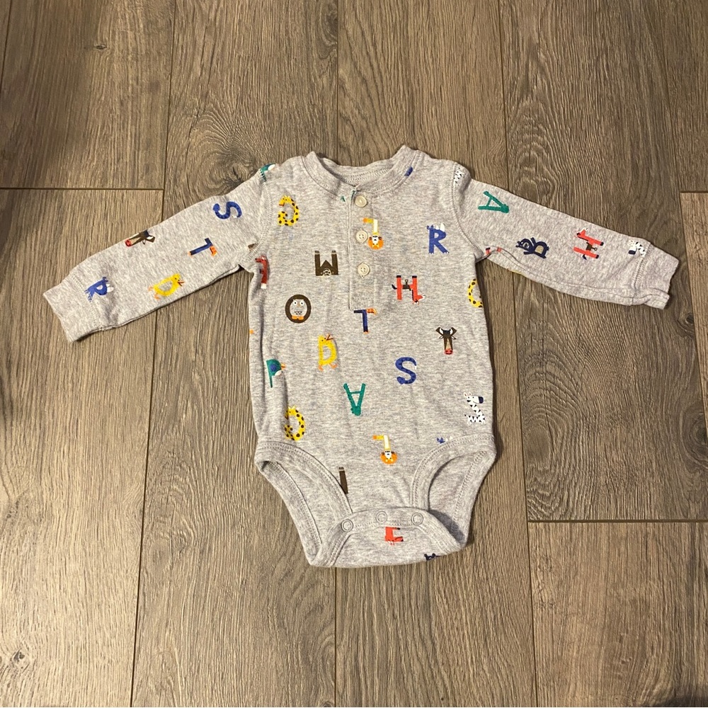 3/$12- Carter’s alphabet onesie